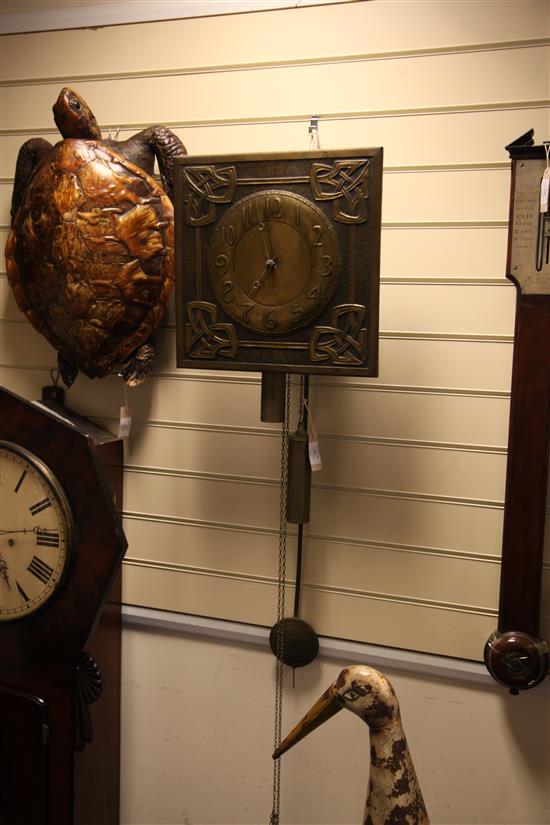 Margaret Gilmour (1860-1942). A Scottish Arts & Crafts brass wag at the wa wall clock, 14.75in.